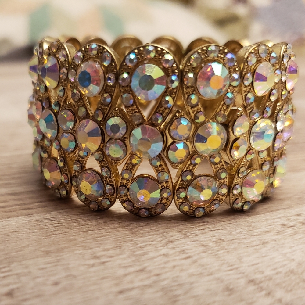 Beautiful AB stone on gold color stretch band bracelet.